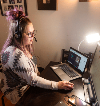 Female master of arts in TESOL graduate student at Cornerstone University teaching her class virtually from her desk