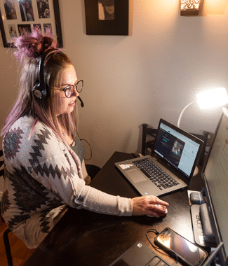 Female master of arts in TESOL graduate student at Cornerstone University teaching her class virtually from her desk