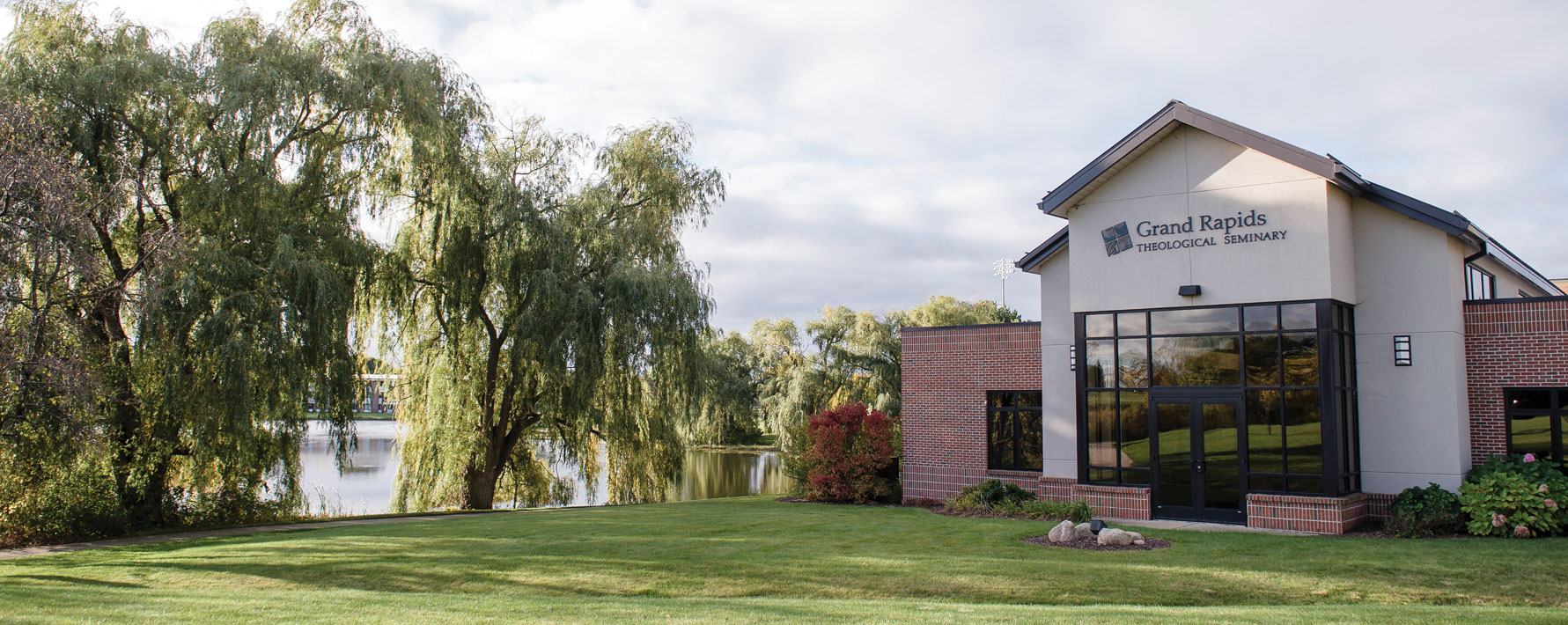 Grand Rapids Theological Seminary academic building and faculty offices located next to the pond on the campus of Cornerstone University