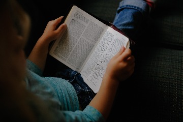 woman holding book