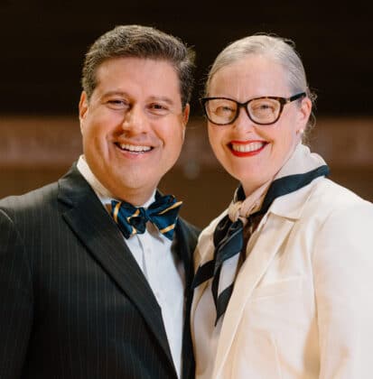 Gerson and Ellen Moreno-Riaño standing on the stage of Christ Chapel at Cornerstone University
