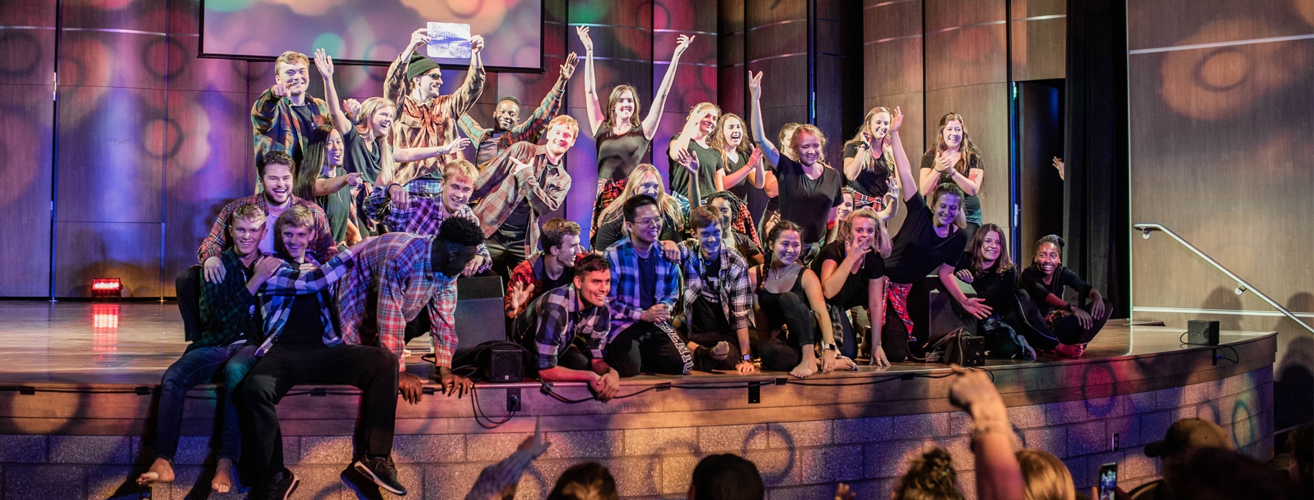 College students on auditorium stage in Matthews Performing Arts Center at Cornerstone University