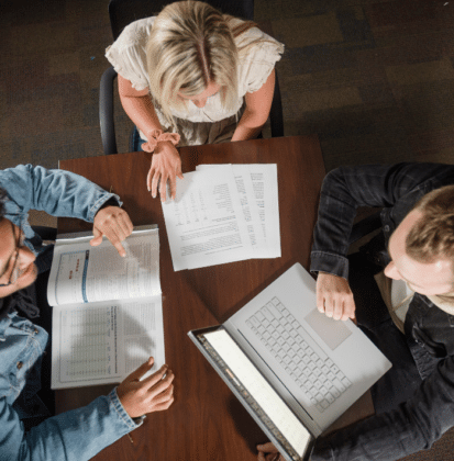 Trio of business finance students studying