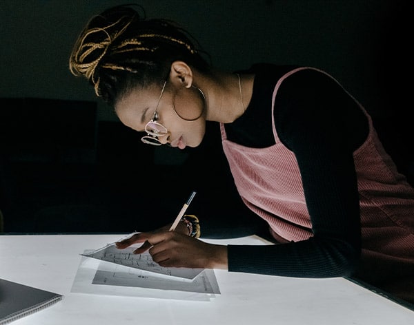 A student works on her graphic design skills at Cornerstone University