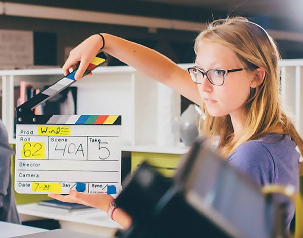 Media production student on set to enhance her skills