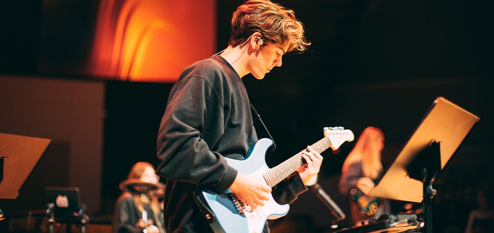 Cornerstone student leading worship