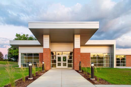 Exterior of a brick and metal office building that houses the WCSG radio team