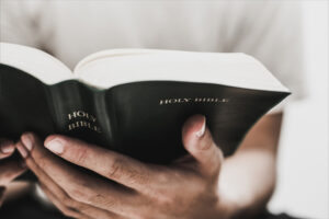 An open Bible being read at Cornerstone Theological Seminary.