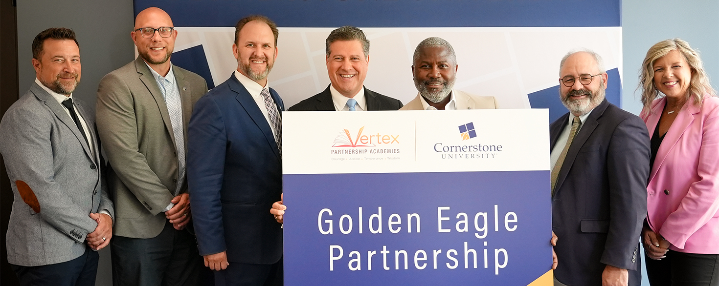 Cornerstone University President Gerson Moreno-Riaño and Ian Rowe, co-founder of Vertex Partnership Academies, join university leaders for a Golden Eagle Partnership signing ceremony between Cornerstone and Vertex Partnership Academies