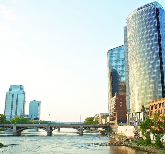 Office buildings alongside the Grand River that runs through downtown Grand Rapids
