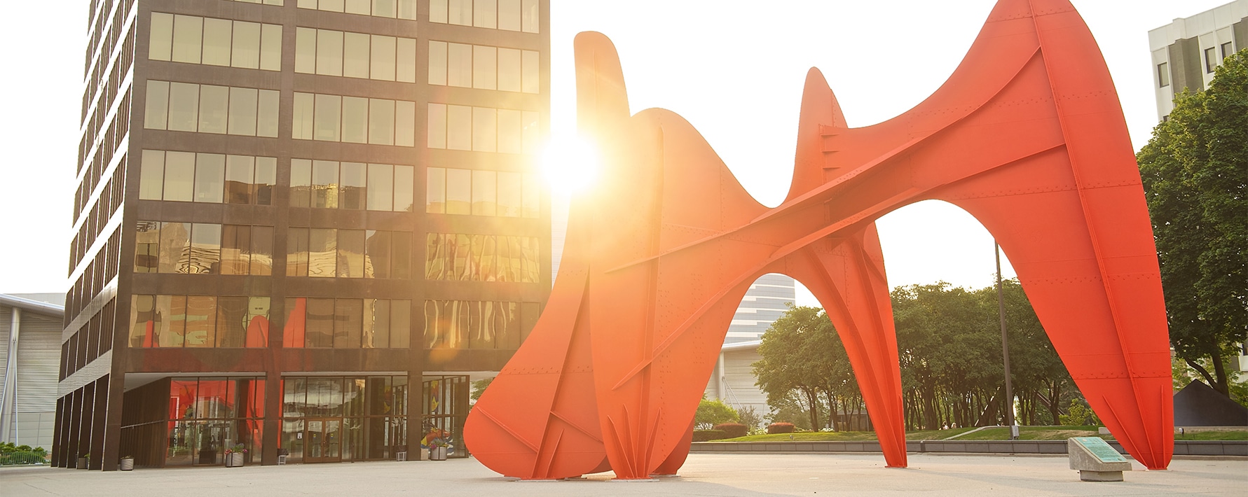 The sculpture La Grande Vitesse created by artist Alexander Calder located in downtown Grand Rapids with the setting sun in the background