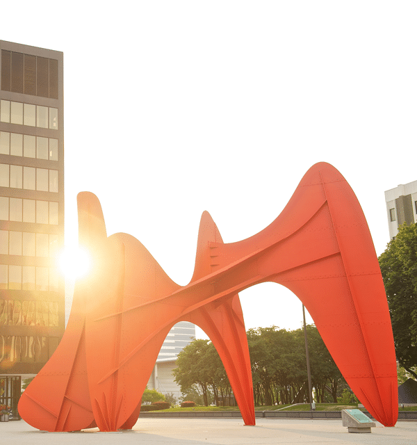 The sculpture La Grande Vitesse created by artist Alexander Calder located in downtown Grand Rapids with the setting sun in the background