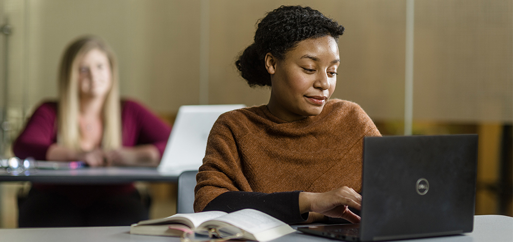 Cornerstone University student working on her computer