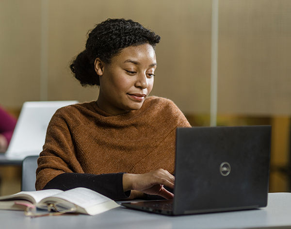 Cornerstone University student working on her computer