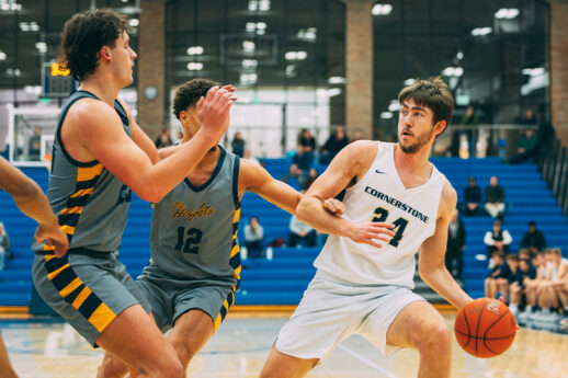 Cornerstone University Golden Eagles Men's Basketball player dribbles during game in Mol Arena
